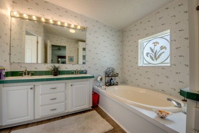 This beautiful two-bedroom, two-bath plus den home is located in on Pine Lakes Country Club in Florida - for sale on GolfHomes.com, golf home, golf lot