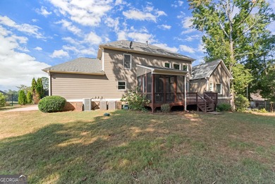 Welcome home to this stunning 5-bedroom, 3.5-bathroom gem on Traditions of Braselton Golf Club in Georgia - for sale on GolfHomes.com, golf home, golf lot