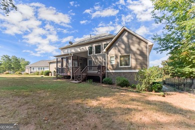 Welcome home to this stunning 5-bedroom, 3.5-bathroom gem on Traditions of Braselton Golf Club in Georgia - for sale on GolfHomes.com, golf home, golf lot