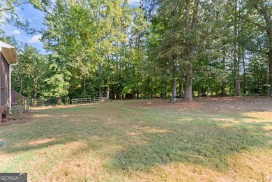 Welcome home to this stunning 5-bedroom, 3.5-bathroom gem on Traditions of Braselton Golf Club in Georgia - for sale on GolfHomes.com, golf home, golf lot