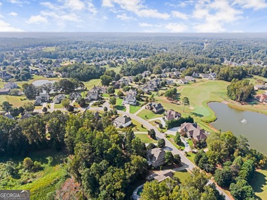 Welcome home to this stunning 5-bedroom, 3.5-bathroom gem on Traditions of Braselton Golf Club in Georgia - for sale on GolfHomes.com, golf home, golf lot