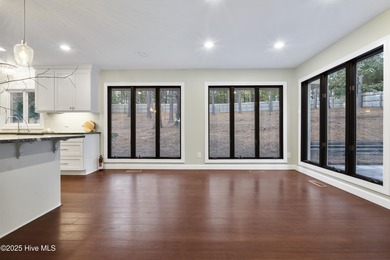 Tucked away among the lovely trees, this brick ranch is nestled on Southern Pines Country Club in North Carolina - for sale on GolfHomes.com, golf home, golf lot