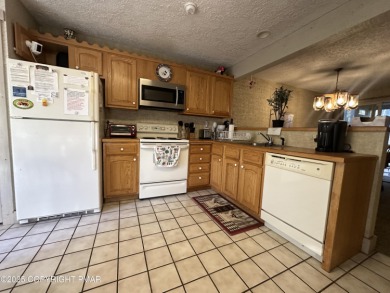 Welcome to 844 Crest Pine Lane - a charming 3-bedroom, 2.5 bath on Pinecrest Lake Golf and Country Club in Pennsylvania - for sale on GolfHomes.com, golf home, golf lot