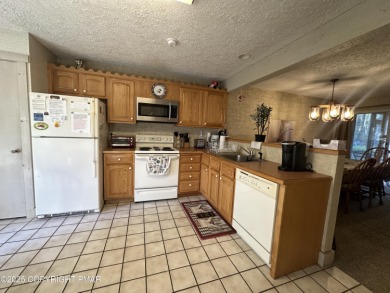 Welcome to 844 Crest Pine Lane - a charming 3-bedroom, 2.5 bath on Pinecrest Lake Golf and Country Club in Pennsylvania - for sale on GolfHomes.com, golf home, golf lot