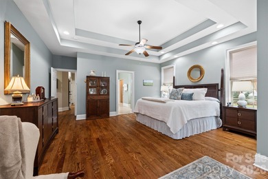 Anchoring a prominent corner lot in Woodbridge North, this on Woodbridge Golf Links in North Carolina - for sale on GolfHomes.com, golf home, golf lot