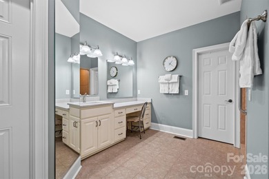 Anchoring a prominent corner lot in Woodbridge North, this on Woodbridge Golf Links in North Carolina - for sale on GolfHomes.com, golf home, golf lot