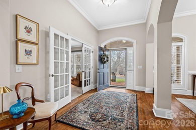 Anchoring a prominent corner lot in Woodbridge North, this on Woodbridge Golf Links in North Carolina - for sale on GolfHomes.com, golf home, golf lot