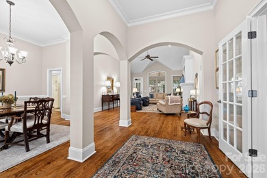 Anchoring a prominent corner lot in Woodbridge North, this on Woodbridge Golf Links in North Carolina - for sale on GolfHomes.com, golf home, golf lot