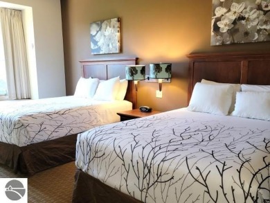 Need a place to call your own for overnight stays?  The Lodge at on Cedar River Golf Course in Michigan - for sale on GolfHomes.com, golf home, golf lot