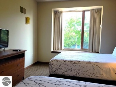 Need a place to call your own for overnight stays?  The Lodge at on Cedar River Golf Course in Michigan - for sale on GolfHomes.com, golf home, golf lot