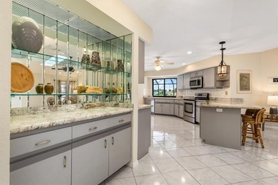 Spectacular mini estate lakefront, pool home offering 3 bedrooms on Deep Creek Golf Club in Florida - for sale on GolfHomes.com, golf home, golf lot