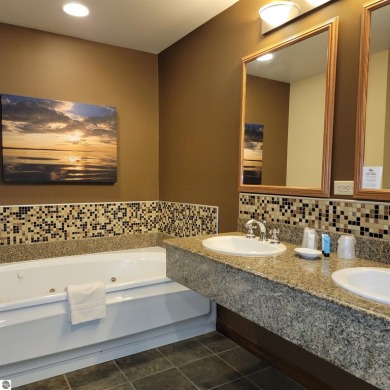 Need a place to call your own for overnight stays?  The Lodge at on Cedar River Golf Course in Michigan - for sale on GolfHomes.com, golf home, golf lot