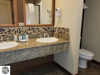 Need a place to call your own for overnight stays?  The Lodge at on Cedar River Golf Course in Michigan - for sale on GolfHomes.com, golf home, golf lot