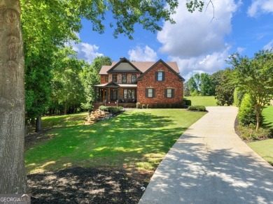 Welcome home to 70 Baker Pond Ct - a rare and timeless retreat on Traditions of Braselton Golf Club in Georgia - for sale on GolfHomes.com, golf home, golf lot