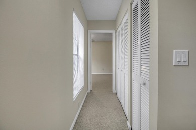 Beautifully maintained 2-story patio home in Prestwick Chase on PGA National Golf Club in Florida - for sale on GolfHomes.com, golf home, golf lot