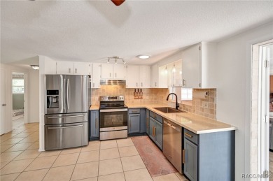 Nestled in a serene and quiet neighborhood, this meticulously on Plantation Inn and Golf Resort  in Florida - for sale on GolfHomes.com, golf home, golf lot