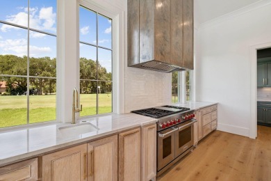 Welcome to the epitome of luxury living with this stunning new on Regatta Bay Golf and Country Club in Florida - for sale on GolfHomes.com, golf home, golf lot