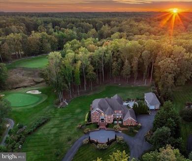 Set behind a private automated gate on nearly 3 acres, this on Golf Club At South River in Maryland - for sale on GolfHomes.com, golf home, golf lot