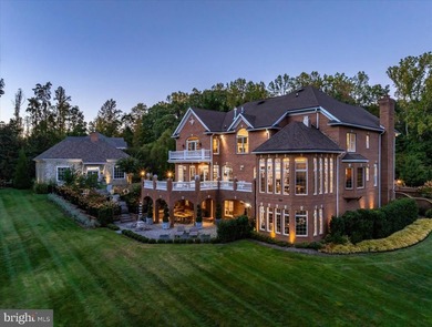 Set behind a private automated gate on nearly 3 acres, this on Golf Club At South River in Maryland - for sale on GolfHomes.com, golf home, golf lot