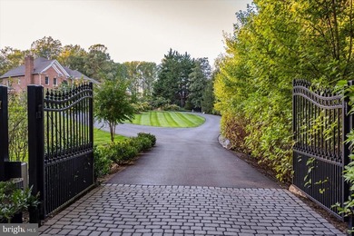 Set behind a private automated gate on nearly 3 acres, this on Golf Club At South River in Maryland - for sale on GolfHomes.com, golf home, golf lot