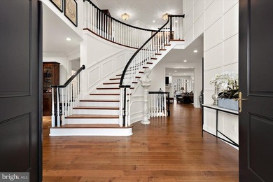 Set behind a private automated gate on nearly 3 acres, this on Golf Club At South River in Maryland - for sale on GolfHomes.com, golf home, golf lot