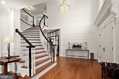 Set behind a private automated gate on nearly 3 acres, this on Golf Club At South River in Maryland - for sale on GolfHomes.com, golf home, golf lot