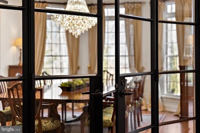 Set behind a private automated gate on nearly 3 acres, this on Golf Club At South River in Maryland - for sale on GolfHomes.com, golf home, golf lot