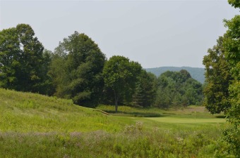 This beautiful wooded home site at the Mountain Club directly on Boyne Mountain Resort - Monument Course in Michigan - for sale on GolfHomes.com, golf home, golf lot
