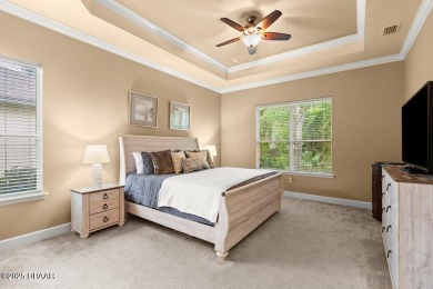 Welcome Home to your private oasis nestled along a peaceful on Plantation Bay Golf and Country Club in Florida - for sale on GolfHomes.com, golf home, golf lot