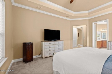 Welcome Home to your private oasis nestled along a peaceful on Plantation Bay Golf and Country Club in Florida - for sale on GolfHomes.com, golf home, golf lot