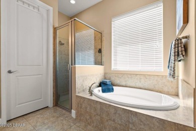 Welcome Home to your private oasis nestled along a peaceful on Plantation Bay Golf and Country Club in Florida - for sale on GolfHomes.com, golf home, golf lot