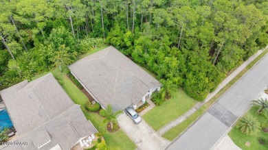 Welcome Home to your private oasis nestled along a peaceful on Plantation Bay Golf and Country Club in Florida - for sale on GolfHomes.com, golf home, golf lot
