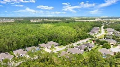 Welcome Home to your private oasis nestled along a peaceful on Plantation Bay Golf and Country Club in Florida - for sale on GolfHomes.com, golf home, golf lot