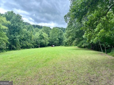 Picturesque 1.29-acre lot overlooks the 12th green, featuring a on Mountain Harbour Golf Club in North Carolina - for sale on GolfHomes.com, golf home, golf lot