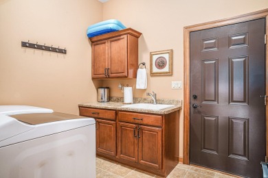 Charming LAKEFRONT RANCH WITH WALKOUT BASEMENT WITH OVER 3300 on Lake of Four Seasons Country Club in Indiana - for sale on GolfHomes.com, golf home, golf lot