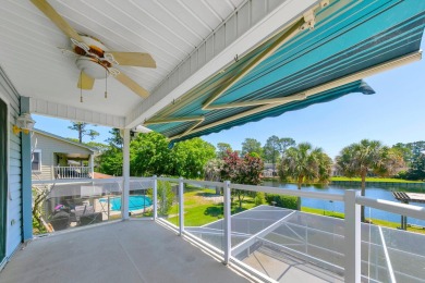 LAKEFRONT LIVING IN GATED SOUTHWIND - ROOM TO UPDATE, VIEWS TO on Golf Club at Bluewater Bay Resort in Florida - for sale on GolfHomes.com, golf home, golf lot