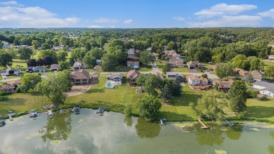 Charming LAKEFRONT RANCH WITH WALKOUT BASEMENT WITH OVER 3300 on Lake of Four Seasons Country Club in Indiana - for sale on GolfHomes.com, golf home, golf lot