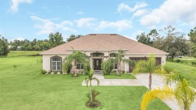 Stunning Lakefront Estate Home!!  With a 3-way split floorplan on Wedgefield Golf Club in Florida - for sale on GolfHomes.com, golf home, golf lot