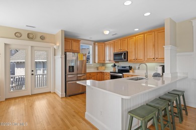 This exquisite high-dunes cottage exudes coastal charm with on Bald Head Island Golf Club in North Carolina - for sale on GolfHomes.com, golf home, golf lot