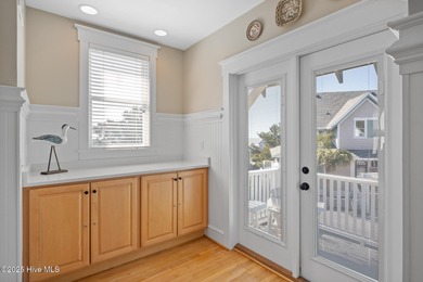 This exquisite high-dunes cottage exudes coastal charm with on Bald Head Island Golf Club in North Carolina - for sale on GolfHomes.com, golf home, golf lot