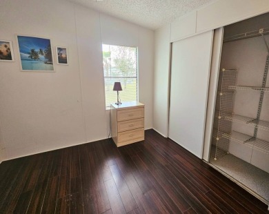 Located in a 55+ resort-style manufactured home community on on Big Cypress Golf and Country Club in Florida - for sale on GolfHomes.com, golf home, golf lot