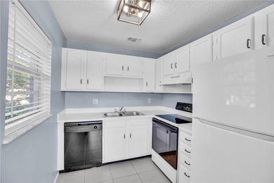 Welcome to easy Florida living at 105 Spring Lake Ct. #203 in on The American Golf Club in Florida - for sale on GolfHomes.com, golf home, golf lot