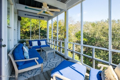 This exquisite high-dunes cottage exudes coastal charm with on Bald Head Island Golf Club in North Carolina - for sale on GolfHomes.com, golf home, golf lot