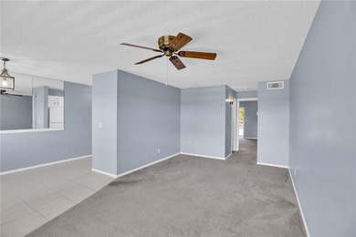 Welcome to easy Florida living at 105 Spring Lake Ct. #203 in on The American Golf Club in Florida - for sale on GolfHomes.com, golf home, golf lot