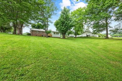 Charming home nestled in Hidden Valley. Only a few steps away on Hidden Valley Golf and Country Club in Tennessee - for sale on GolfHomes.com, golf home, golf lot
