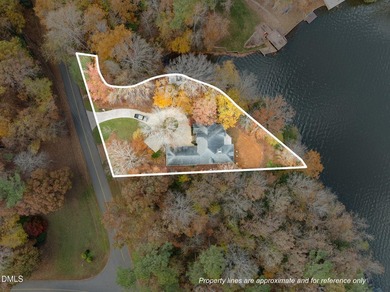 Gorgeous Lakefront estate! From the moment you enter, you're on River Golf and Country Club at Lake Royale in North Carolina - for sale on GolfHomes.com, golf home, golf lot