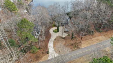 Gorgeous Lakefront estate! From the moment you enter, you're on River Golf and Country Club at Lake Royale in North Carolina - for sale on GolfHomes.com, golf home, golf lot