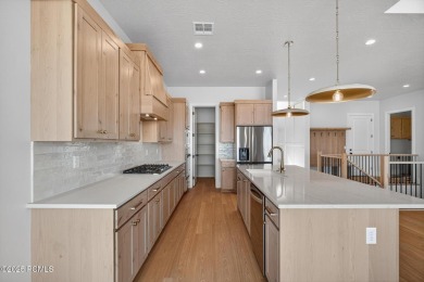 Experience breathtaking views of the city, mountains, and golf on Coral Canyon Golf Course in Utah - for sale on GolfHomes.com, golf home, golf lot