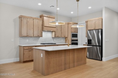 Experience breathtaking views of the city, mountains, and golf on Coral Canyon Golf Course in Utah - for sale on GolfHomes.com, golf home, golf lot