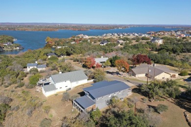 This beautiful hilltop home offers fantastic views of nearby on Apple Rock Golf Course - Horseshoe Bay in Texas - for sale on GolfHomes.com, golf home, golf lot